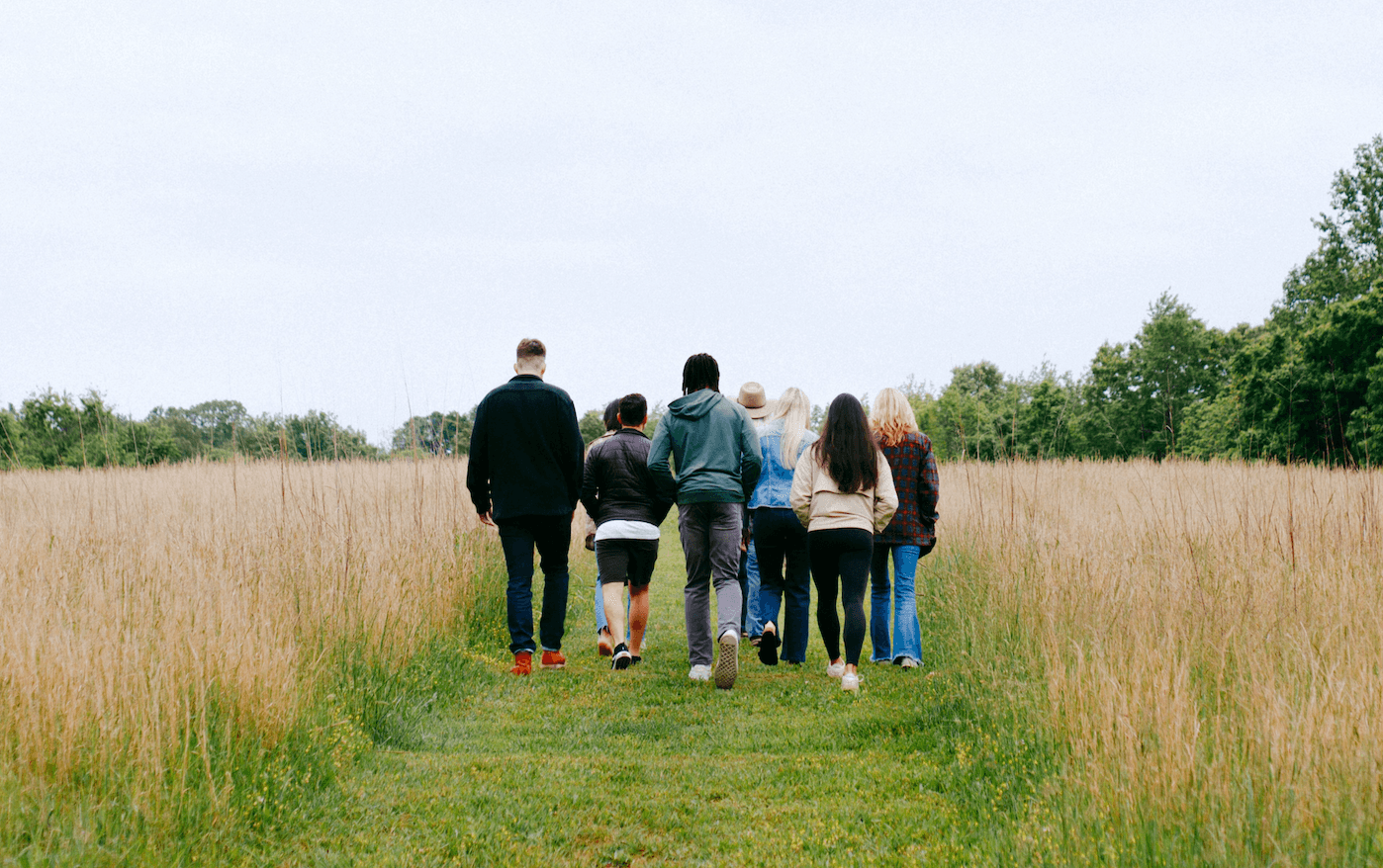 A group walking together along a quiet path.